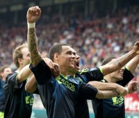 Gregory van der Wiel (M) of Ajax cheers